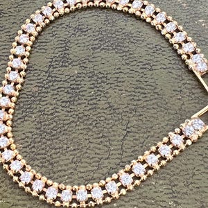 gold metal and glass bracelet