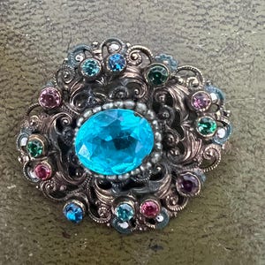 stunning metal and glass Czech brooch