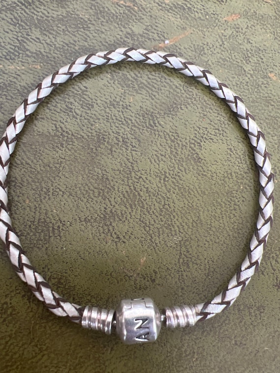Pretty woven bracelet with solid silver - image 1