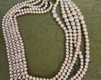 Faux pearl four strand with diamanté catch