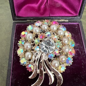 Huge sparkly metal and rhinestone brooch
