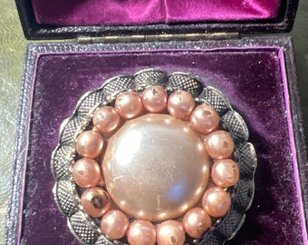 Metal and faux pearl brooch