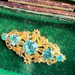 A metal and glass Czech brooch