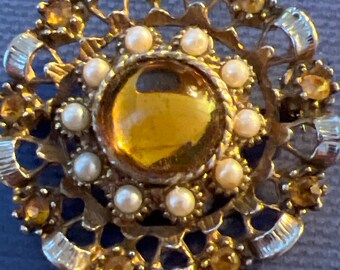 Metal and glass brooch