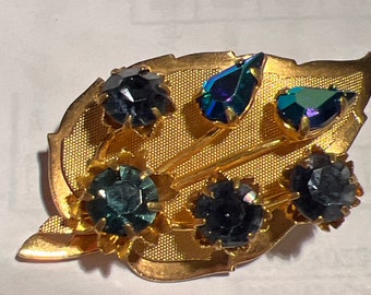 Metal and glass brooch