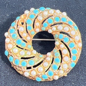 Metal turquoise and seed pearl brooch