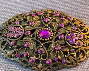 Stunning metal and glass brooch