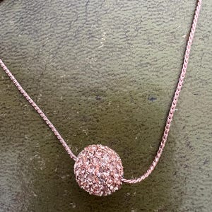 metal and glass ball pendant