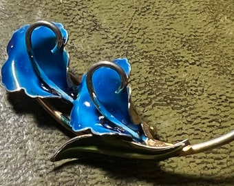 metal and enamel flower brooch