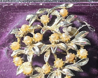 Metal and faux pearl brooch