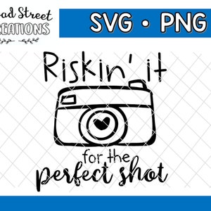 May include: Black and white illustration of a camera with the text "Riskin' it for the perfect shot".