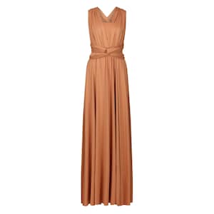 May include: A long, sleeveless maxi dress in a warm brown colour. The dress has a V-neckline and a wrap-style bodice with a tie at the waist.
