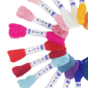 May include: A variety of colors of embroidery floss spools with Japanese text on the labels that reads "刺し子糸" which translates to "Sashiko Thread".
