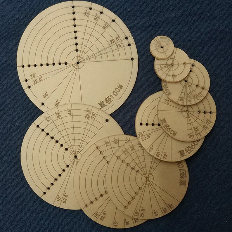 May include: A set of nine circular wooden protractors with different diameters, ranging from 10 cm to 70 cm. Each protractor has markings for degrees and inches, and a center hole for a pencil or pen. The protractors are made of light brown wood and have a natural finish.
