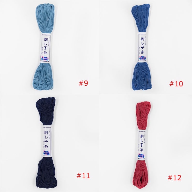 May include: Four spools of embroidery floss in different colours: light blue, dark blue, navy blue, and red. The spools are labelled "刺し子糸" which translates to "Sashiko thread". The numbers 9, 10, 11, and 12 are printed below each spool.