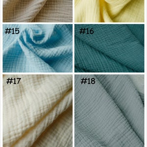 May include: A selection of six fabric swatches in different colours. The colours are beige (#13), yellow (#14), light blue (#15), teal (#16), cream (#17), and grey-blue (#18). Each swatch is labelled with a number.