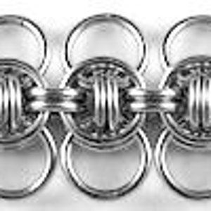 May include: A silver chain made of interlocking rings. The chain has a unique design with a series of small, round, decorative elements.