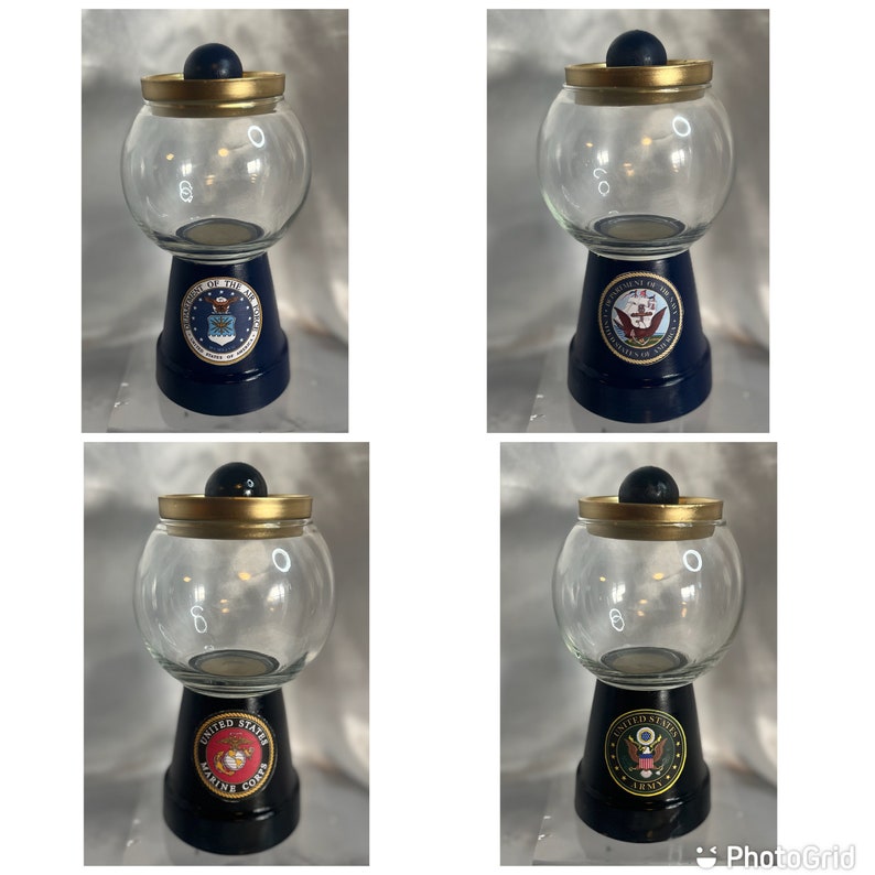 May include: Four glass candy jars with gold lids and blue bases. Each jar features a different branch of the United States Armed Forces: Air Force, Navy, Marines, and Army.