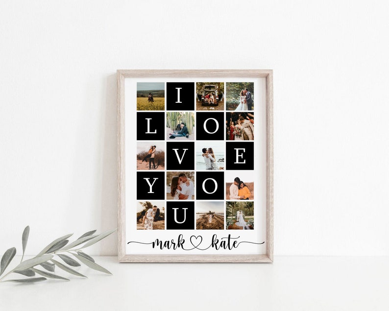May include: A black and white photo collage in a light wood frame. The collage is made up of 25 squares, each containing a photo of a couple. The photos are arranged in a grid, with the letters "I LOVE YOU" spelled out in the centre. The bottom of the collage reads "mark &hearts; kate".