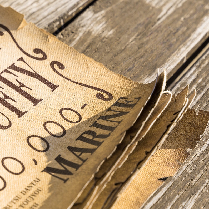May include: Close-up of a stack of brown paper with the text "OFFY" and "00-000-0" printed in black. The text "MARINE" is printed in black on the top sheet of paper.