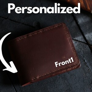 May include: A brown leather wallet with the text "Front1" embossed on the front.
