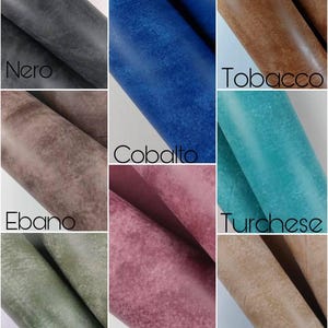 May include: Nine different colors of leather swatches, including black, brown, blue, green, purple, and turquoise. Each swatch has a textured surface and is labeled with its color name in Italian.