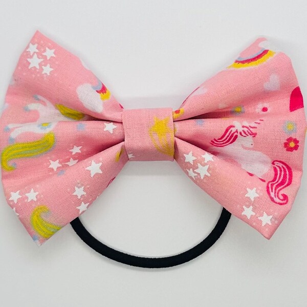 Small child’s pink unicorn & rainbow hair bow.