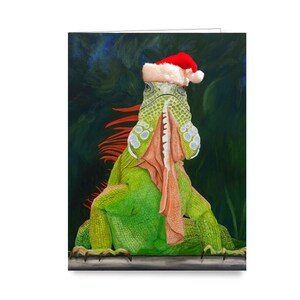 Iguane dans la carte de voeux de vacances de Santa Hat. Art d'iguane. Lézard en bonnet de Noel. Vacances de style méridional.