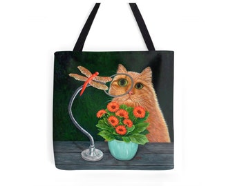 Whimsical Orange Tabby Cat and Dragonfly tote bag. Ginger Cat, bowl of daisies and dragonfly, colorful bag. Washable polyester.