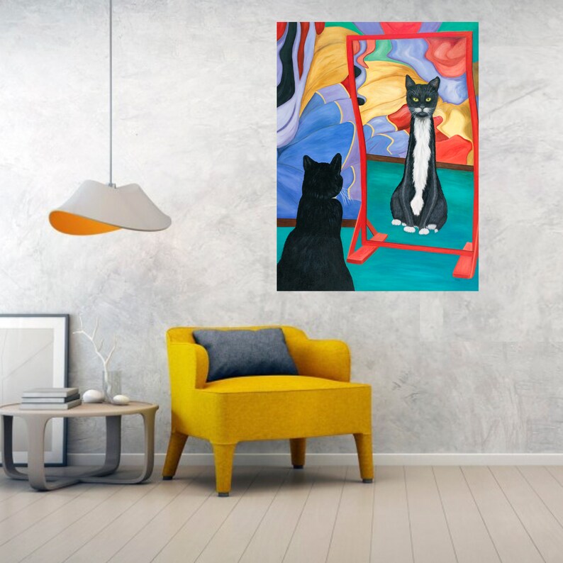 May include: A black cat looks at its reflection in a red and blue abstract mirror. The cat in the mirror has a white stripe down its back.