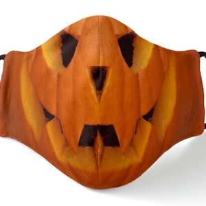 Scary Carved Pumpkin Halloween mask. Kids and Adults. Comfortable polyester. Machine washable. Soft and breathable in several styles.