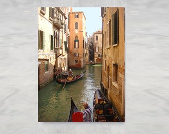 Venice Gondolas stretched canvas wall art. Gondolas make their way around the winding canals in beautiful Venice, Italy. Canvas giclee print