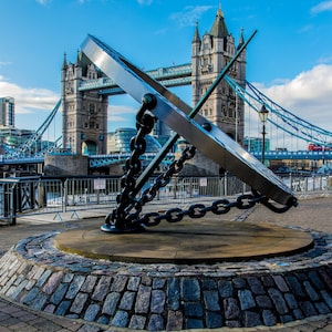Tower Bridge along the River Thames on a sunny afternoon in London, England Framed Photo Print