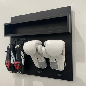 Exercise room organizer shelving with hooks for shoes and boxing gloves