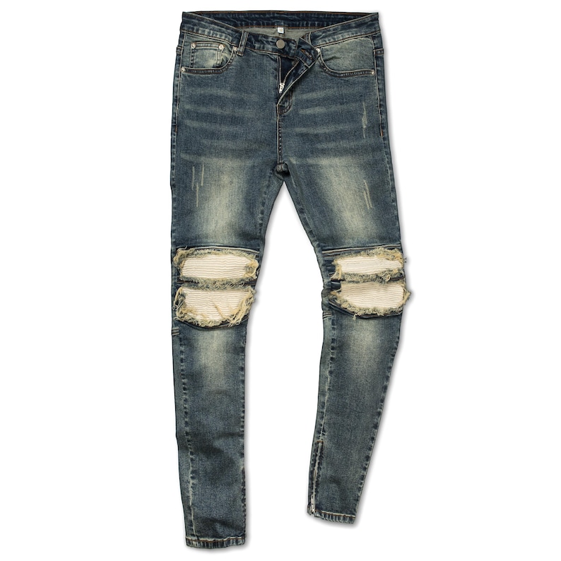May include: Blue denim jeans with distressed details and white knee patches.
