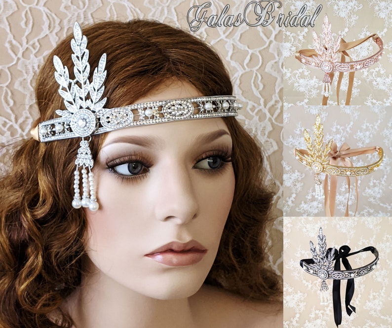 May include: A silver headband with a pearl and crystal design. The headband has a leaf-shaped design on one side and a row of crystals and pearls on the other. The headband is shown on a model with brown hair.