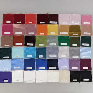 May include: A colour chart of fabric swatches in various colours, including red, pink, orange, yellow, green, blue, purple, brown, grey, and white.