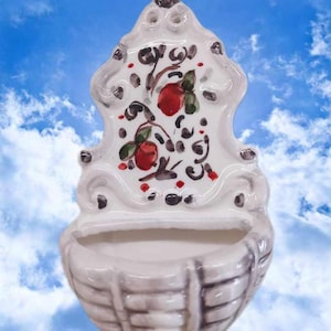 holy water font hand made in Italy. Will be send you with a guarantee artisanal and historical reproduction piece. Majolica stoup