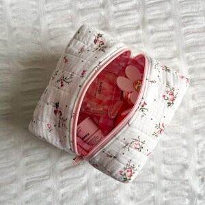Trousse de maquillage/cosmétiques matelassée à fleurs rose layette