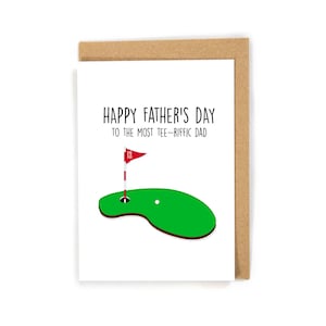 May include: Happy Father's Day to the most Tee-Rific Dad card with a green golf course and a red flag with the number 18 on it.