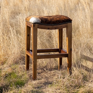 western cowhide stool, leather saddle stool, farmhouse barstool, rustic kitchen stool, wood and cowhide barstool, ranch decor furniture, handcrafted barstool, solid wood stool, western home decor, cowboy bar chair hide cowhide
