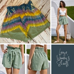 May include: Two pairs of green shorts. One pair is a tie-dye pattern with a green base and yellow, purple, and blue accents. The other pair is a solid green colour with a drawstring waist.