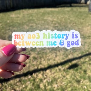 May include: A rainbow sticker with the text "my ao3 history is between me & god" on a white background.