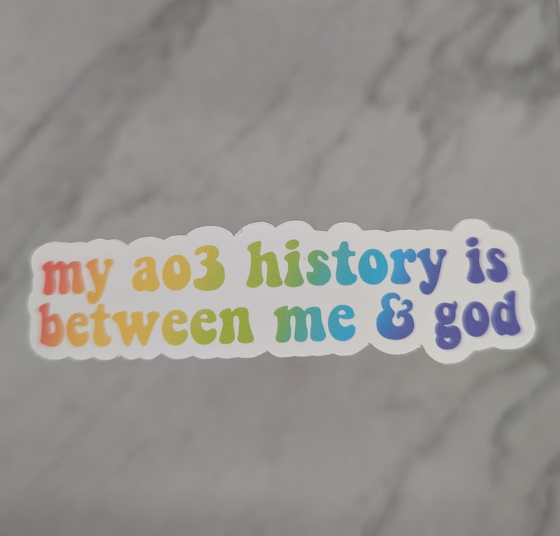May include: A sticker with a rainbow gradient design that reads "my ao3 history is between me & god".