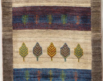 Fine hand-woven beige rug with tree