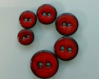 Buttons, red, various sizes
