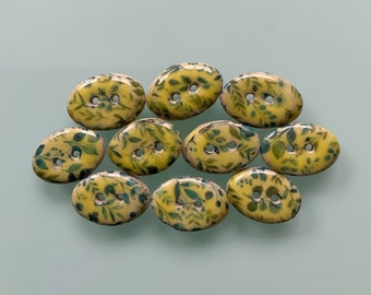 10 buttons oval yellow with small flowers