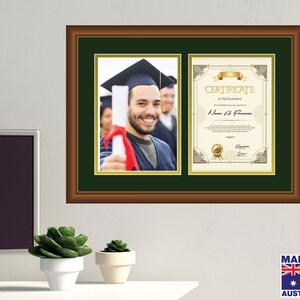May include: A brown wooden frame with a green mount displays a diploma and a photograph of a graduate wearing a cap and gown. The diploma features a gold seal and the text "Certificate of Achievement".