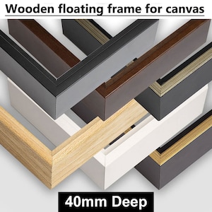 May include: A close-up of six different wooden floating frames for canvas, each with a 40mm depth. The frames are in various colours, including natural wood, black, white, brown, and gold.