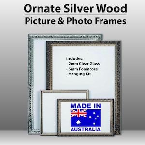 May include: Three ornate silver picture frames with a white background. The largest frame has the text "Includes: - 2mm Clear Glass - 5mm Foamcore - Hanging Kit". The smallest frame has the text "MADE IN AUSTRALIA" and a blue Australian flag.